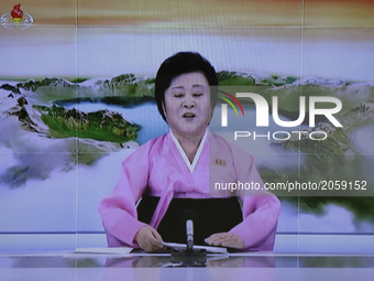 In this image made from video of a news bulletin Tuesday, July 4, 2017, North Korea's KRT television shows a presenter announcing North Kore...