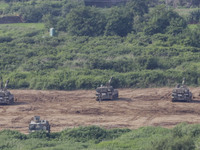 South Korean army's K-9 self-propelled howitzers move during an annual exercise in Paju, near the border with North Korea, South Korea, Tues...