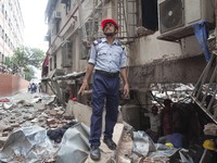 Bangladeshi workers take part in a search and rescue operation at a destroyed garment factory in Gazipur on July 4, 2017, after a boiler exp...