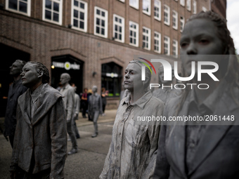 Germany, Hamburg on 7 July 2017. In the art performance the protagonists wear encrusted clothes and stand for a society that has emerged fro...