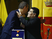 Former Argentinian football player Diego Armando Maradona (R) embrace mayor of Naples Luigi De Magistris (L),  during a ceremony at the city...