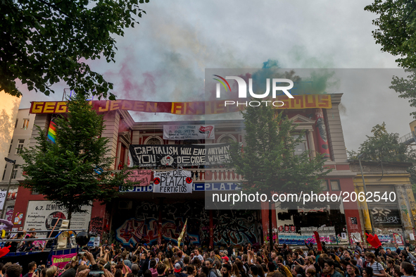 The demonstration passes the autonomous center Rote Flora. About 20000 people demonstrated in a march with several music cars against the G2...