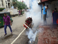 An employee of Dhaka North City Corporation sprays pesticide for kill mosquitoes at Tejgaon in Dhaka, Bangladesh on July 06, 2017. (