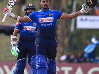 Sri Lankan cricketer Danushka Gunathilaka celebrates after scoring a century against Zimbabwe during their 3rd One Day International cricket...