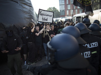 Police Forces clash with protesters during a march on July 7, 2017 in Hamburg, Germany. Leaders of the G20 group of nations are arriving in...