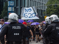 Students join thousands of protesters in the streets of Hamburg, Germany to denounce the G20 summit on July 7, 2017.  (
