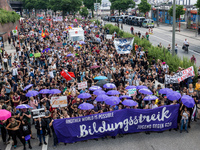 Students join thousands of protesters in the streets of Hamburg, Germany to denounce the G20 summit on July 7, 2017.  (
