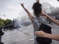 Woman during riots in St. Pauli district during G 20 summit in Hamburg on July 8, 2017 . Authorities are braced for large-scale and disrupti...