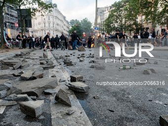 Torn-out stones are lying on a street, in Hamburg, Germany, on July 7, 2017. In the evening there was a lot of riots in the Schanzenviertel...