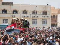 Egyptians carry the coffin of a soldier, who was killed a day earlier in the restive Sinai Peninsula in an attack by the Islamic State group...