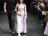Helena Kirk (R) - a Cancer survivor walking on the runway during the Fashion against Cancer fundraising event in Toronto, Canada on 7 July 2...