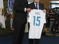 Theo Hernandez (L) of Real Madrid poses with President Florentino Perez during his official presentation at Estadio Santiago Bernabeu on Jul...