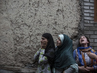 Relatives of a local rebel Sajad Gilkar wail, during his funeral procession Wednesday, July 12, 2017 in Srinagar, Indian-administered Kashmi...