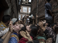 Relatives of a local rebel Sajad Gilkar wail, during his funeral procession Wednesday, July 12, 2017 in Srinagar, Indian-administered Kashmi...