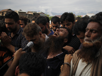 A kashmiri  Leading the prayers screams during the funeral prayers of   local pro-independence fighter  Sajad Ahmed Gilkar in old city Srina...