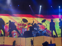 The shadow on the flag of Spain of the components of Scorpions during his concert  on the El Malecon football stadium in Torrelavega, Cantab...
