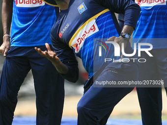 Sri Lanka's former cricket captain Angelo Mathews tries to catch a ball during a warm up session ahead of the Test match against the visitin...