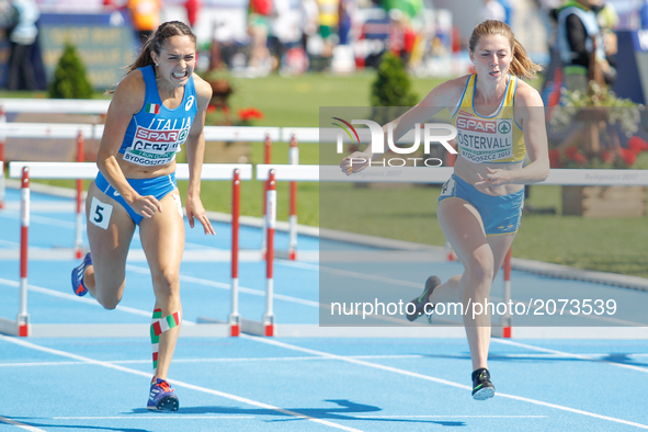 Lucia Quaglieri of Italy (l) and Lovisa Ostervan of Sweden are seen competing in the 100m hurdles during the U23 European Atheltics Champion...