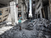 Palestinians in a house destroyed in the neighborhood Shujaiya, east of Gaza City 0.06 Israel withdrew its last troops from the Gaza Strip o...