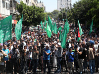 Palestinian supporters of Hamas during the show of support and support for the Hamas delegation negotiating team in Cairo. Israeli Prime Min...