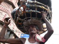 Indian Daily labor carry of goods at the Asia biggest wholesale market  Barabazar area on July 14,2017 in Kolkata, India.  (