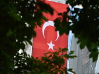 A huge Turkish flag is seen on the wall of a building marking the 1st anniversary of Turkey's failed coup attempt in Ankara, Turkey on July...