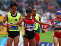 Jin Zheng 0f China and Guide Zipeng Wang 
Women's 1500m T11 Round 1 Heat 1
during IPC World Para Athletics Championships at London Stadium i...