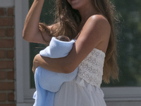 Malena Costa, wife of Mario Suárez, poses with her son Mario after leaving the hospital in Madrid, Spain, on 15 July 2017. The model gave bi...