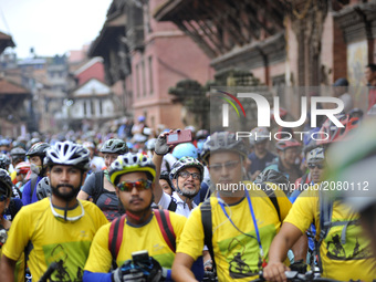 A Cyclist takes picture from mobile during Kathmandu Kora Cycling 2017 RIDE for a CAUSE at Patan Durbar Square, Patan, Nepal onSaturday, Jul...