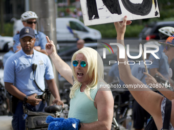 Michael Hisey, dressed up as Kellyanne Conway, takes part in an anti-Trump Refuse Racism rally in Philadelphia, Pennsylvania, on July 15, 20...