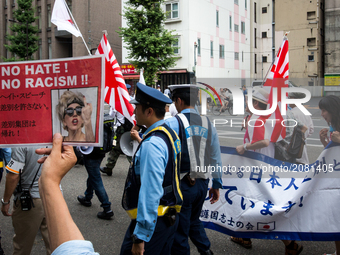 Japanese nationalists holding Japanese flags took to the streets in a 