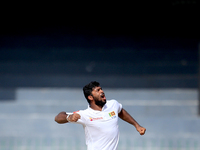 Sri Lankan cricketer  Lahiru Kumara celebrates the dismissal of Zimbabwe's Peter Moor(unseen) during the third day's play of the only test c...