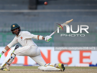 Zimbabwe cricketer Sikandar Raza plays a shot run  during the third day's play of the only test cricket match between Sri Lanka and Zimbabwe...