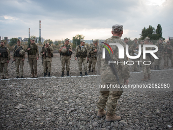 Pro-Ukraine soldiers line up at a military base in Kramatorsk, Ukraine, on 4 October, 2016. (