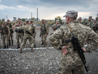 Pro-Ukraine soldiers line up at a military base in Kramatorsk, Ukraine, on 4 October, 2016. (