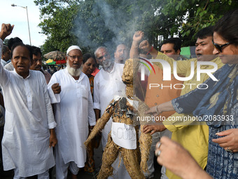 Supporters of  Muslim Rashtriya Mancha  burn effigy Xi Jinping President of China  and protest the ban for chanciness products in India on J...