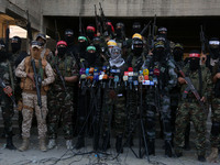 Palestinian militants from different local factions hold a press conference in Gaza City on July 18, 2017. (