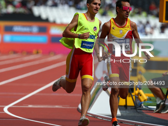  Manuel Garnice of Spain and Guida Pedro Garcia Lopez compete in Men's 1500m  T11 Round 1 Heat 1 during IPC World Para Athletics Championshi...