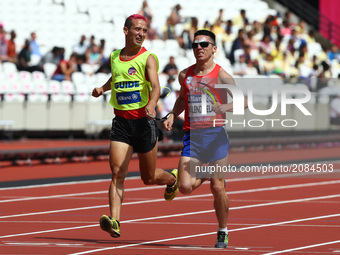 Cristian Valenzuela of China and Guiade Raul Moya and Guida Pedro Garcia Lopez  in Men's 1500m  T11 Round 1 Heat 1 during IPC World Para Ath...