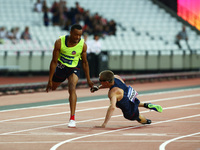 Timothee Adolphe  with Guide Jeffrey Lami compete in Men's 400m T11 Final 
 during IPC World Para Athletics
Championships at London Stadium...