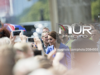 Kate, the Duchess of Cambridge (C) greats people during her visit in Berlin at Brandenburg Gate in Berlin on July 19, 2017.  (