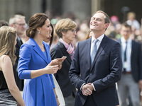 Berlin's Mayor Michael Mueller (R) speaks with Kate, the Duchess of Cambridge (L) in front of Brandenburg Gate in Berlin on July 19, 2017....