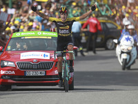 Slovenia's Primoz Roglic celebrates as he crosses the finish line during the 183 km seventeenth stage of the 104th edition of the Tour de Fr...