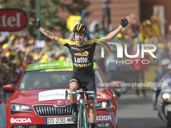 Slovenia's Primoz Roglic celebrates as he crosses the finish line during the 183 km seventeenth stage of the 104th edition of the Tour de Fr...