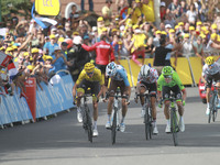 (From L) Great Britain's Christopher Froome wearing the overall leader's yellow jersey, France's Romain Bardet and Colombia's Rigoberto Uran...