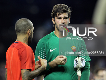 Roma goalkeeper Alisson (1) talks to Paris Saint-Germain Dani Alves (32) after the game during an International Champions Cup match  at Come...