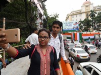A young girl Selfie pictures her Mobile camera with her boy friend and back side  Main Stage  at the last preparation tomorrow Trinamool Con...
