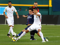 AS Roma midfielder Diego Perotti (8) battles with Paris Saint-Germain midfielder Adrien Rabiot (25) for possession of the ball during an Int...