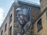 A giant portrait of Nelson Mandela is seen on a wall of Camden, London, on July 21, 2017. The mural has been made to mark 99 years since Nel...