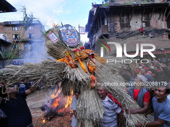 Nepalese devotees carrying straw effigy of the demon Ghantakarna during the Gathemangal festival celebrated at Bhaktapur, Nepal on Friday, J...